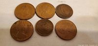 Obverse sides of six coins