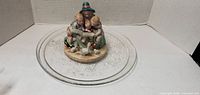 Glass baking plate and ceramic figurine full view