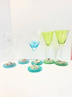 All six glasses front view showing color differences and resin bases