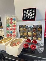 Group shot showing all boxed and packaged ornament sets