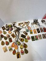 Overview of entire lot showing pendants and ball chains