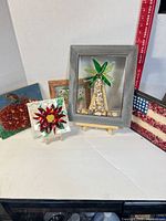 Group shot of all five mosaic art pieces