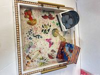 Tray with both coaster sets displayed inside