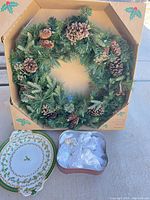 Group shot showing wreath in original sleeve, platter, open tin