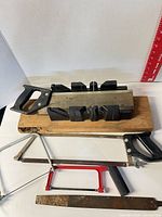 Miter box, backsaw, large and junior hacksaws, file visible