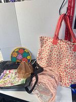 Group shot of all bags, lazy Susan and metal swivel