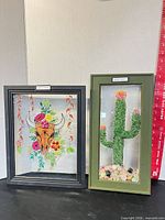 Both framed artworks side by side showing overall size and style