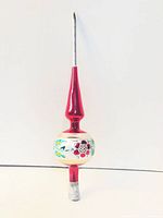 Full view of red, white and silver glass tree topper