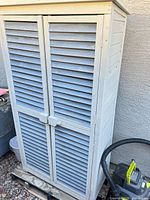 Full view of wooden louvered garden shed