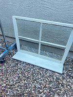 front view of entire window sash showing six panes and bottom shelf