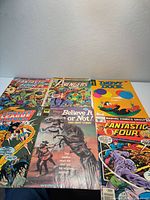 Six comics laid out showing full covers