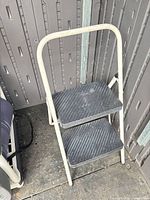 Full view of Cosco 2-step folding step stool standing open