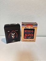 Front view of one 8-track cartridge and slipcase box