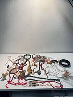 Overview of entire jewelry lot on table