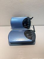Two blue RadioShack 43-124 wireless intercom units top and bottom