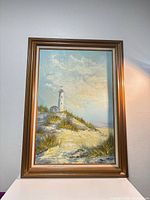 Frontal view of framed oil painting