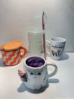 All four Starbucks drinkware items together on white surface