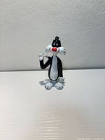 Front view of Sylvester vinyl figurine standing upright