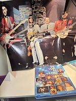 Cheap Trick folded poster with book and 8-track visible