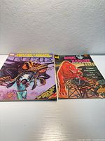 Front covers of both magazines: Eerie with giant insect, Boris Karloff with red creature