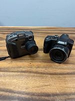 Front view of both Kodak cameras showing bodies, lenses and general condition