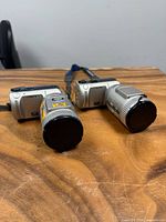 Front view of both cameras with lens caps on