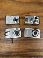 Four compact digital cameras front view