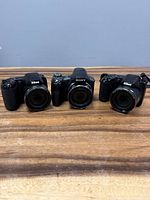 Front view of all three cameras showing lenses and branding