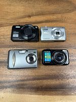 Front view of all four cameras showing brand and model markings