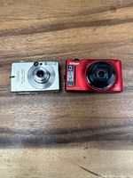 Front view of both cameras showing brand, model and lens details