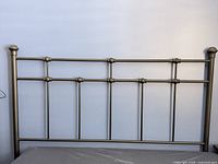 Front view of black queen metal headboard