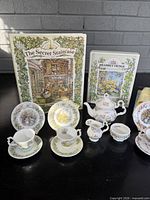 Overall view showing books and majority of tea service