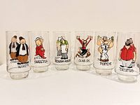 Front view of all six Popeye series glasses showing character graphics