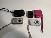 Overview of both cameras, cases, charger and straps