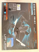 Front of retail box showing Sharper Image video streaming drone model and features
