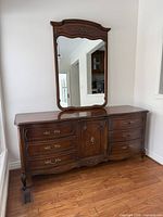 full view of dresser with attached mirror