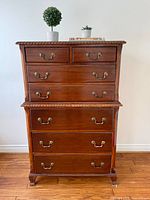 Front view of dresser with two small and three large drawers