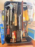 Basket containing assorted hand tools