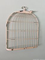 Front view of distressed metal birdcage wall décor