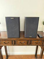 Front view of both Mystere speakers on table