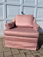 front view of pink fabric armchair with cushion