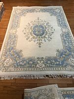 Full view of wool rug showing overall design and fringe