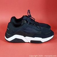 Side view of both sneakers showing overall design, colour and sole