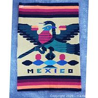 Full view of tapestry showing eagle motif, stripes, and overall colour