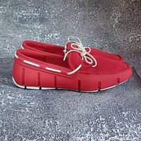 Side profile of both red loafers showing overall style and condition
