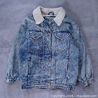 Full front view of acid-wash sherpa denim jacket