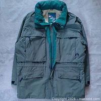 Full front view of green L.L. Bean North Col Gore-Tex jacket showing pockets, zipper, storm flap and overall condition