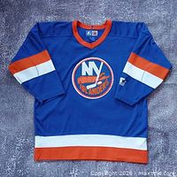 Full front view of blue New York Islanders Starter jersey