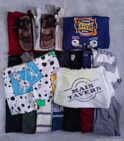 Overview of bundle with sweaters, sandals and shorts
