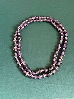 entire necklace coiled to show length and bead style